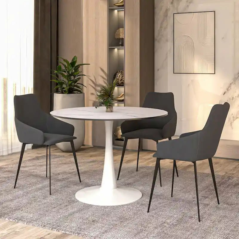 Cette table à manger ronde peut accueillir quatre personnes et dispose d'un plateau en bois MDF et d'une base en acier blanc, la rendant adaptée aux cuisines comme aux salles à manger.